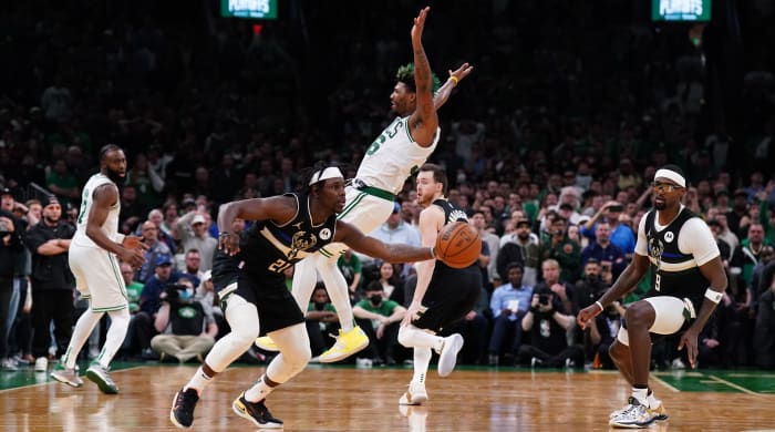 Milwaukee Bucks guard Jrue Holiday (21) steals the ball from Boston Celtics guard Marcus Smart (36) to end the game in the second half during game five of the second round for the 2022 NBA playoffs at TD Garden.